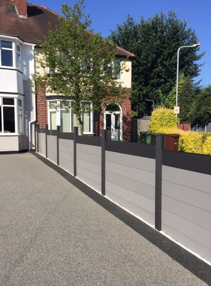 Fencing Installation using Cladco Charcoal Composite Posts and Caps paired with Light Grey Composite Fence Panel