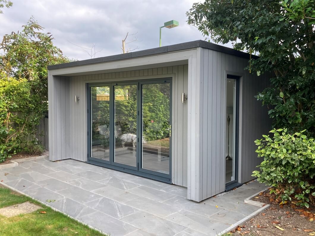 Summer House clad in Stone Grey Cladding Boards