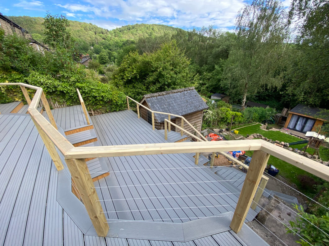 Timber railing encasing Cladco Composite Decking Boards in Stone Grey