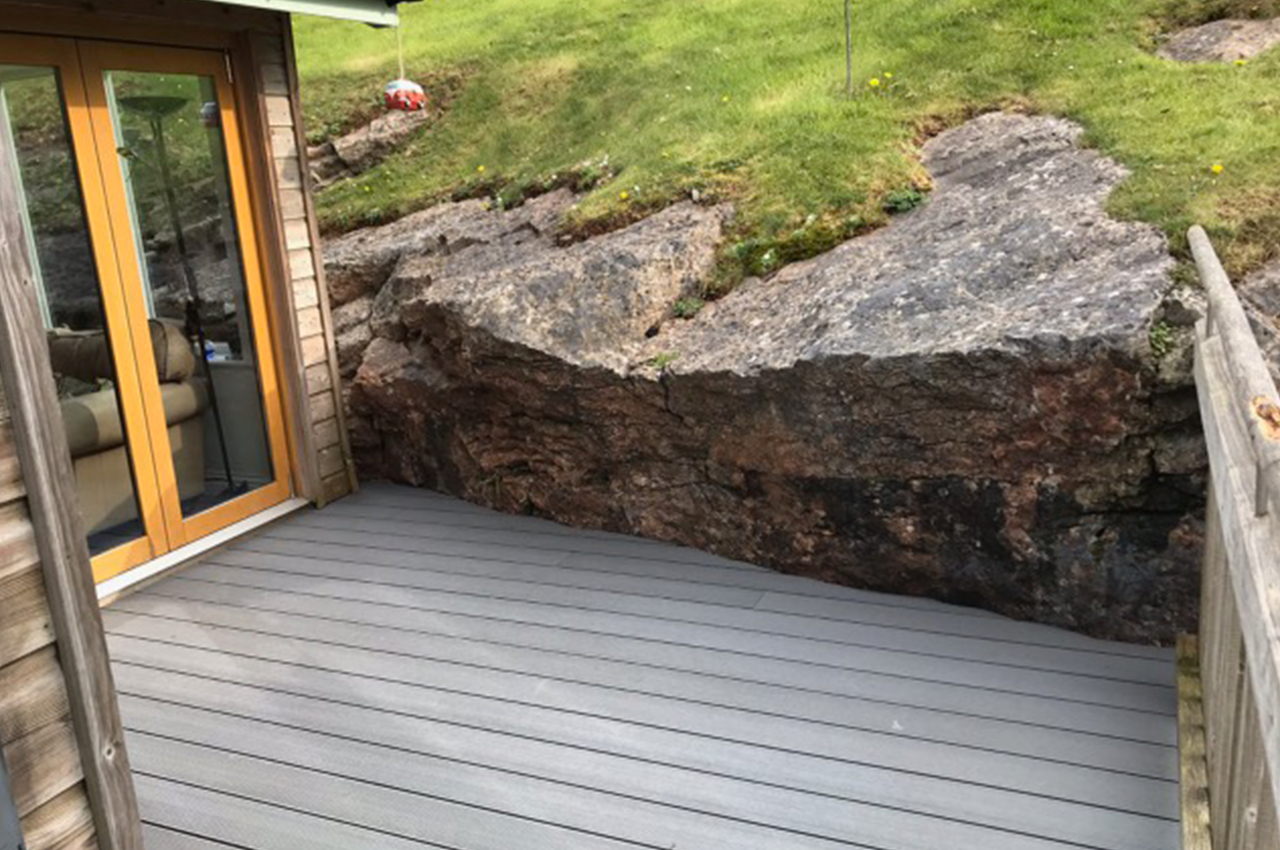 Stone Grey Decking against natural stone