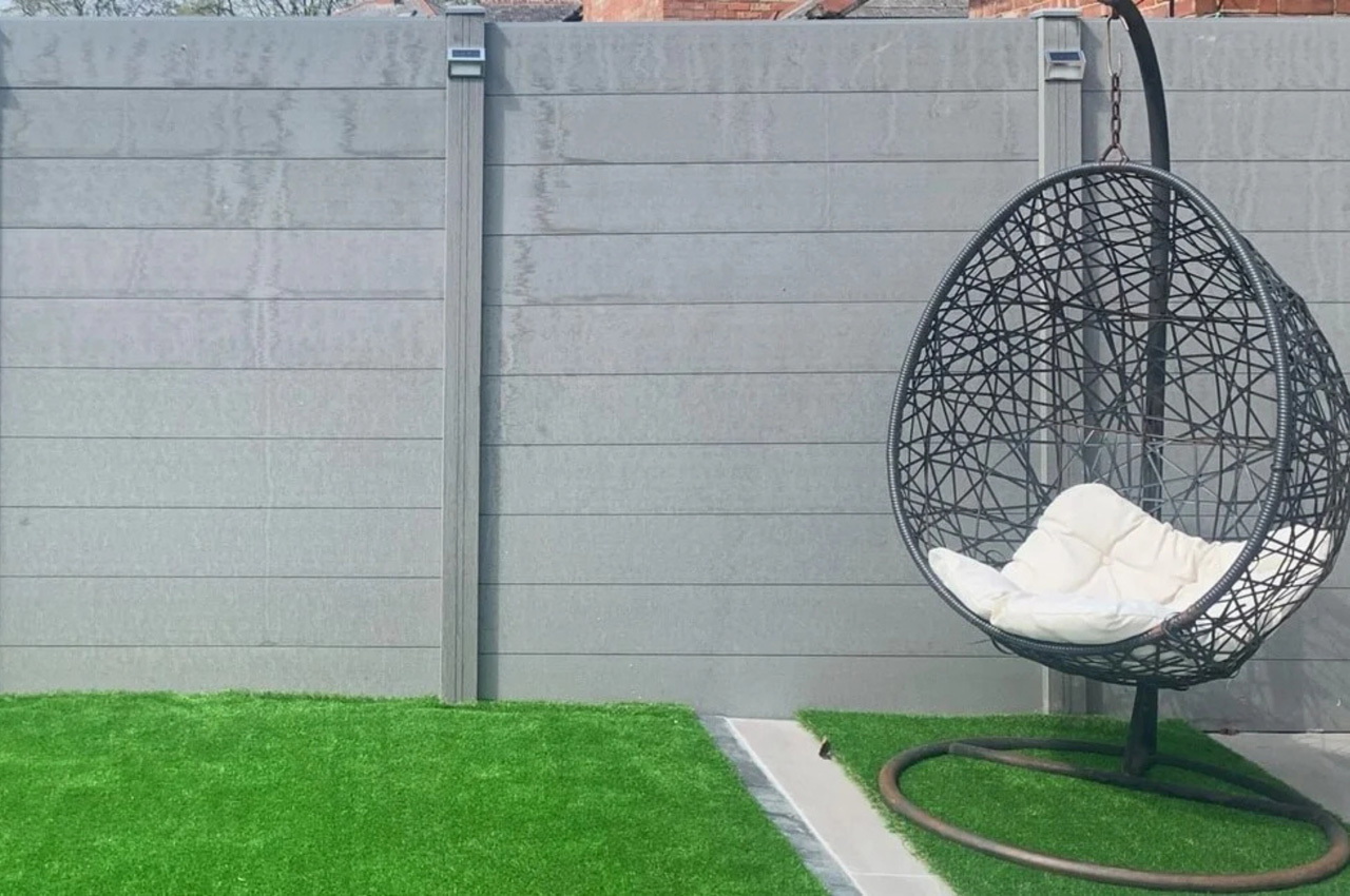 Low-maintenance Composite Fencing and Decking surround a garden hot tub 
