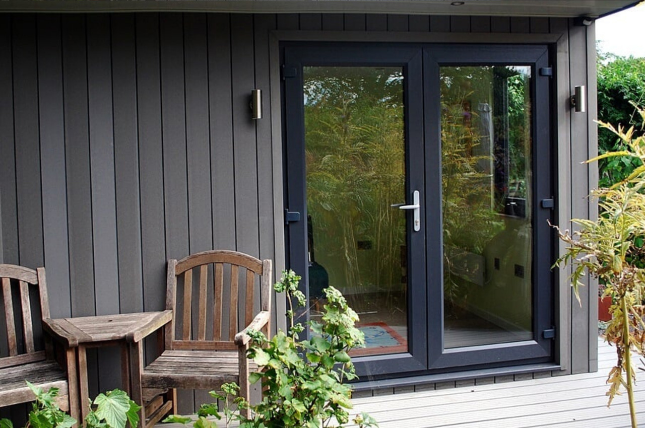 Stone Grey Composite Wall Cladding creates a warm and dry garden retreat.