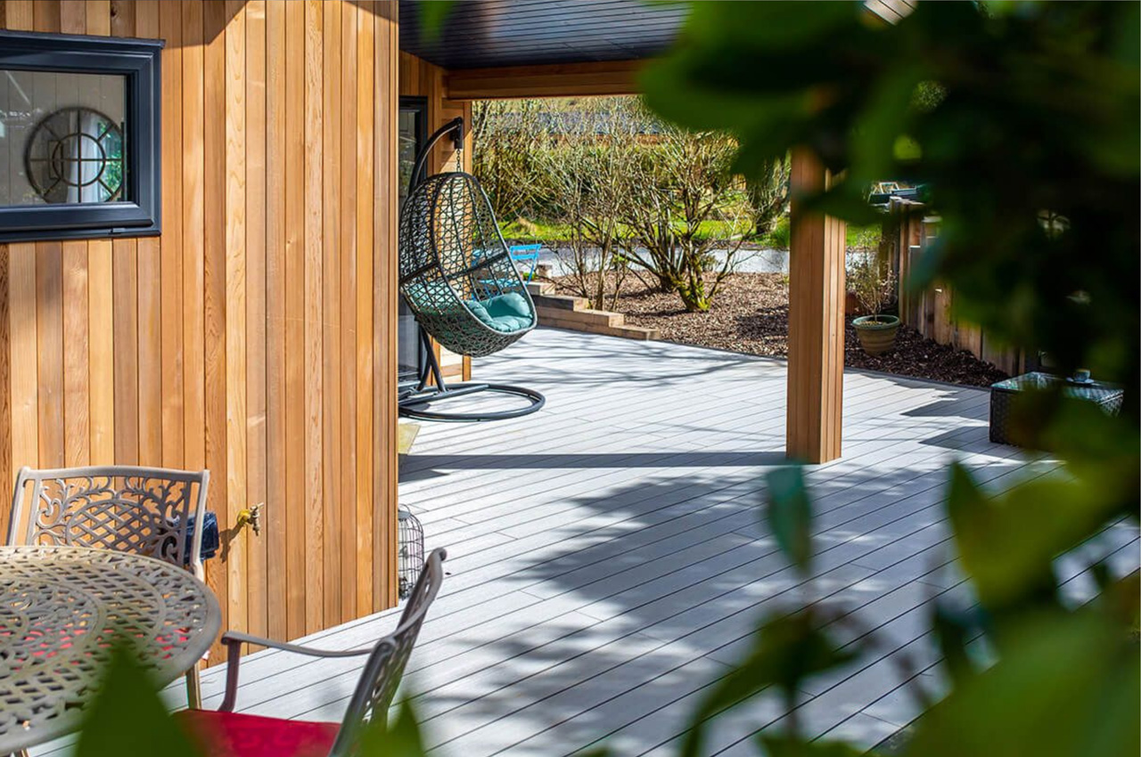 Luxury holiday retreats by Palstone Lodges use Cladco Woodgrain Effect and Original Composite Decking Boards