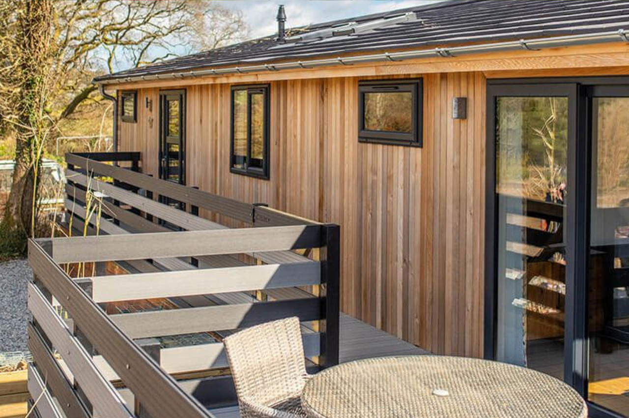 Luxury holiday retreats by Palstone Lodges use Cladco Woodgrain Effect and Original Composite Decking Boards