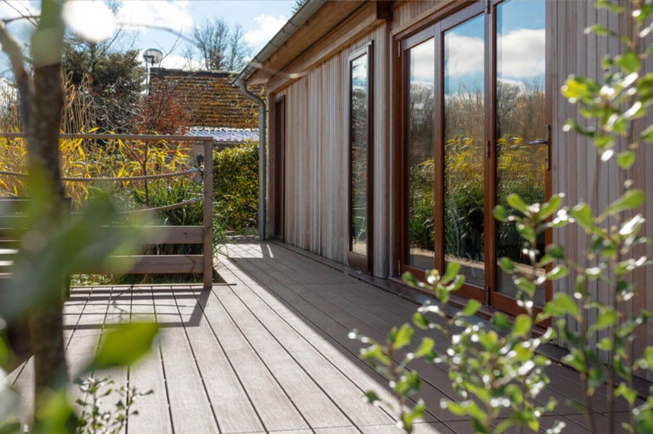 Luxury holiday retreats by Palstone Lodges use Cladco Woodgrain Effect and Original Composite Decking Boards