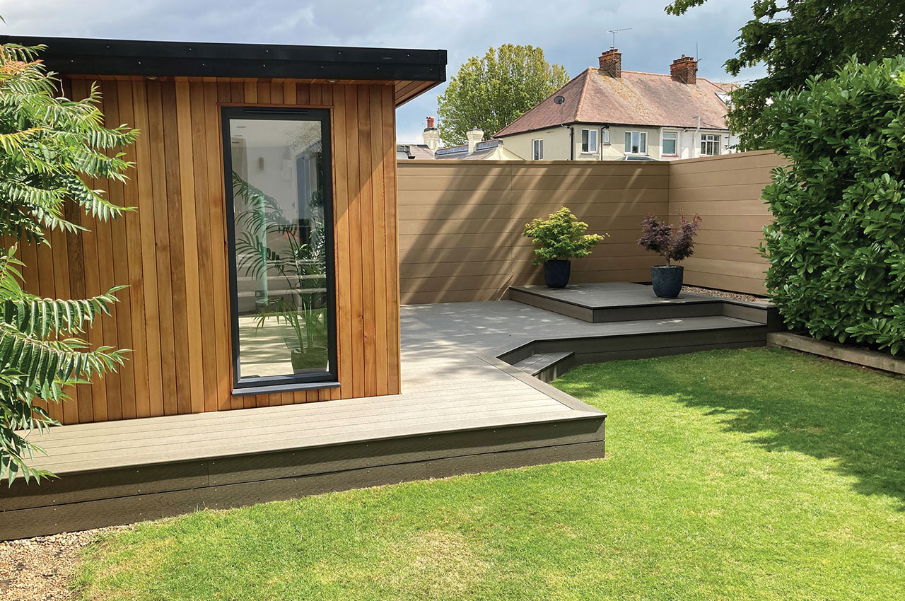 Combination of Composite Decking in Olive Green and Composite Fencing in Teak