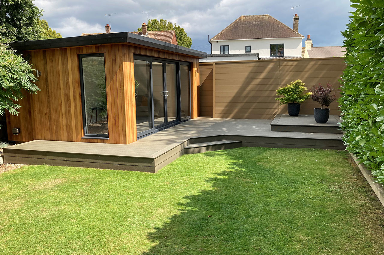 Combination of Composite Decking in Olive Green and Composite Fencing in Teak