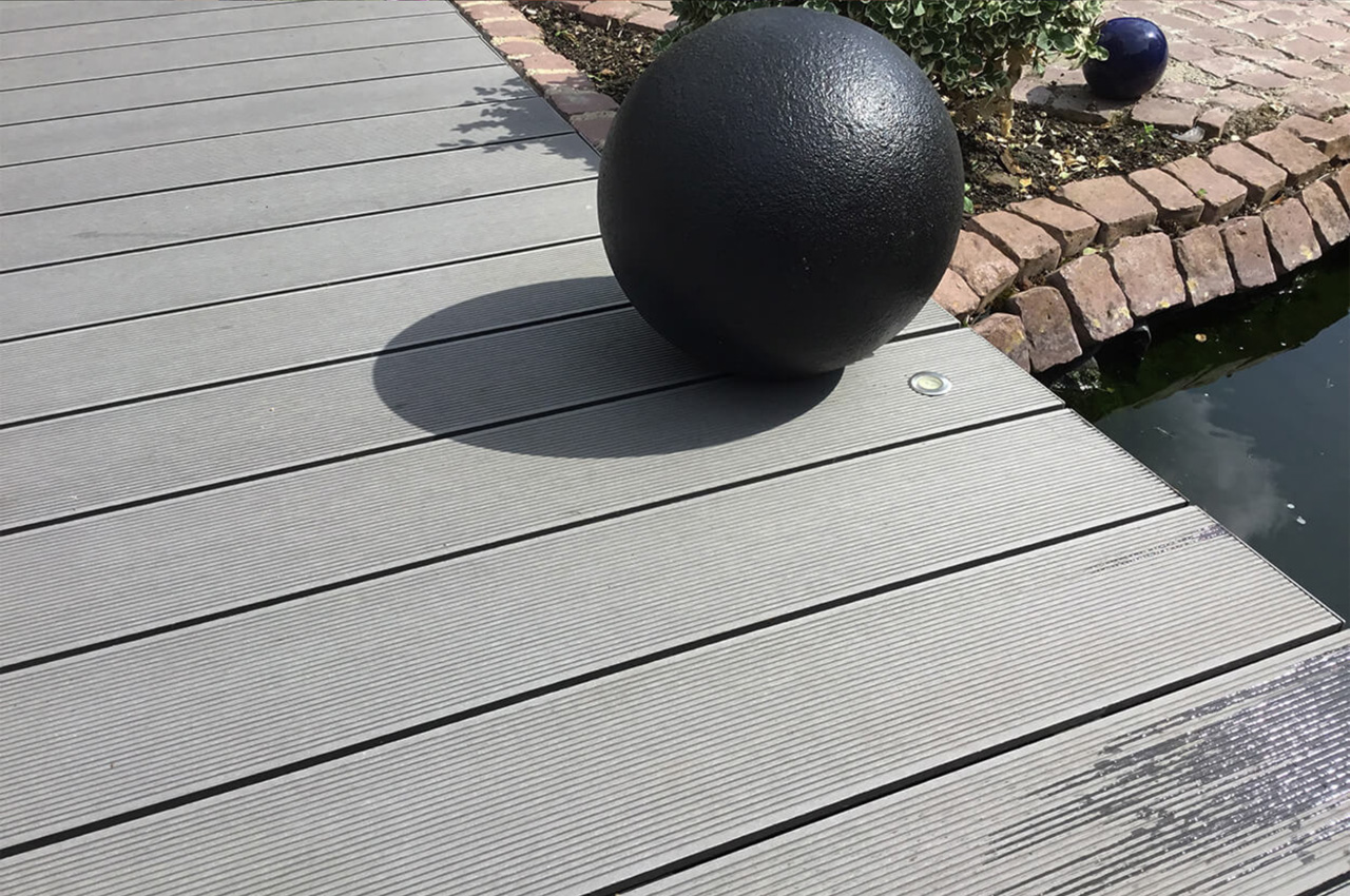 Cladco Composite Decking Boards in Stone Grey with Floral & Stone Boarder