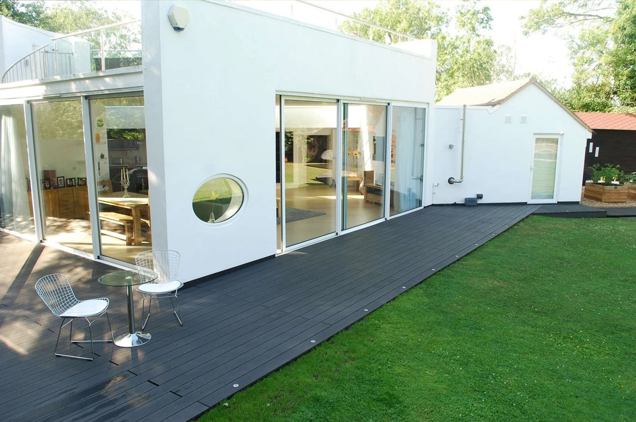 Cladco Composite Decking in Charcoal wraps around a beautiful home