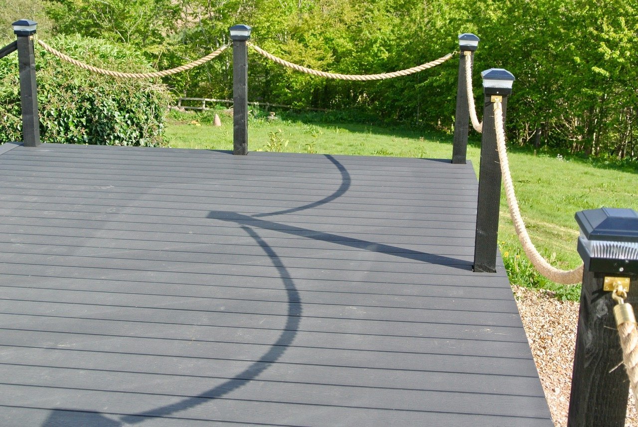 Charcoal Woodgrain Effect Decking Boards with field view