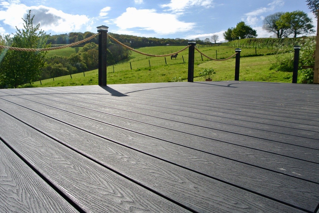 Charcoal Woodgrain Effect Decking Boards with field view