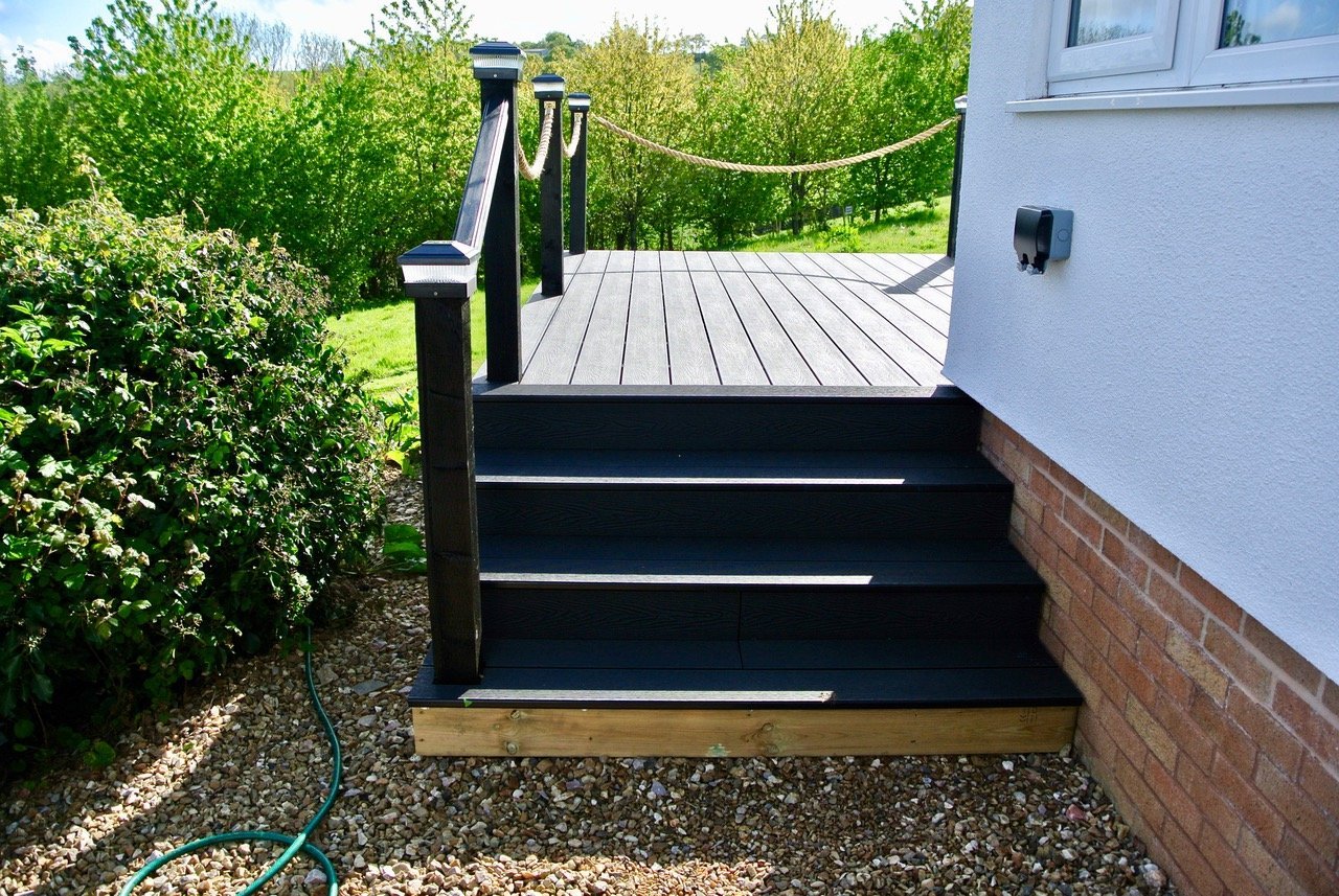 Charcoal Woodgrain Effect Decking Boards with field view