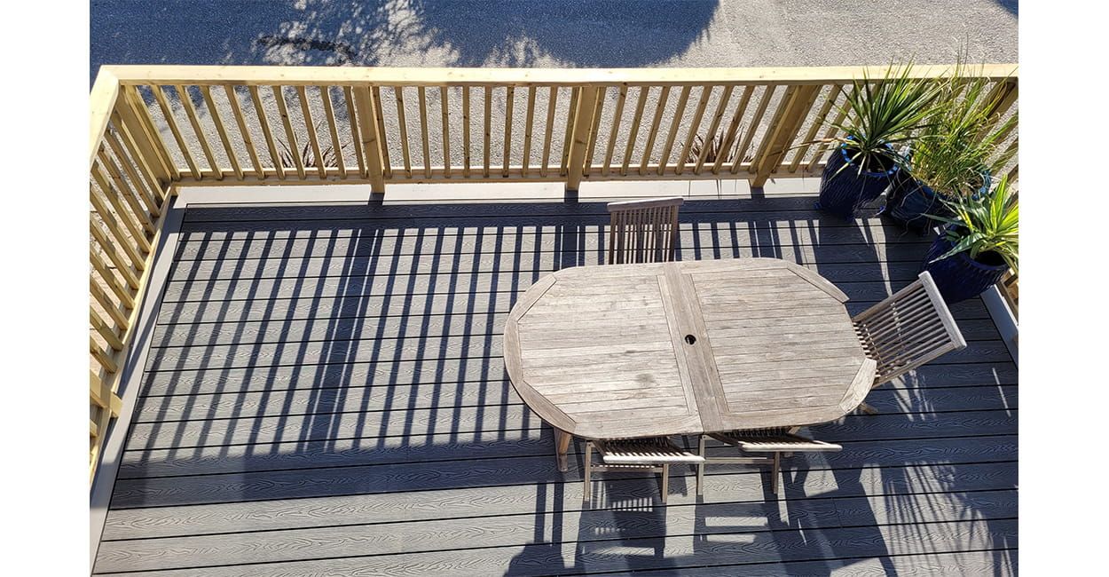 Stone Grey Woodgrain Composite Decking Boards installed by Gull Rock Co.