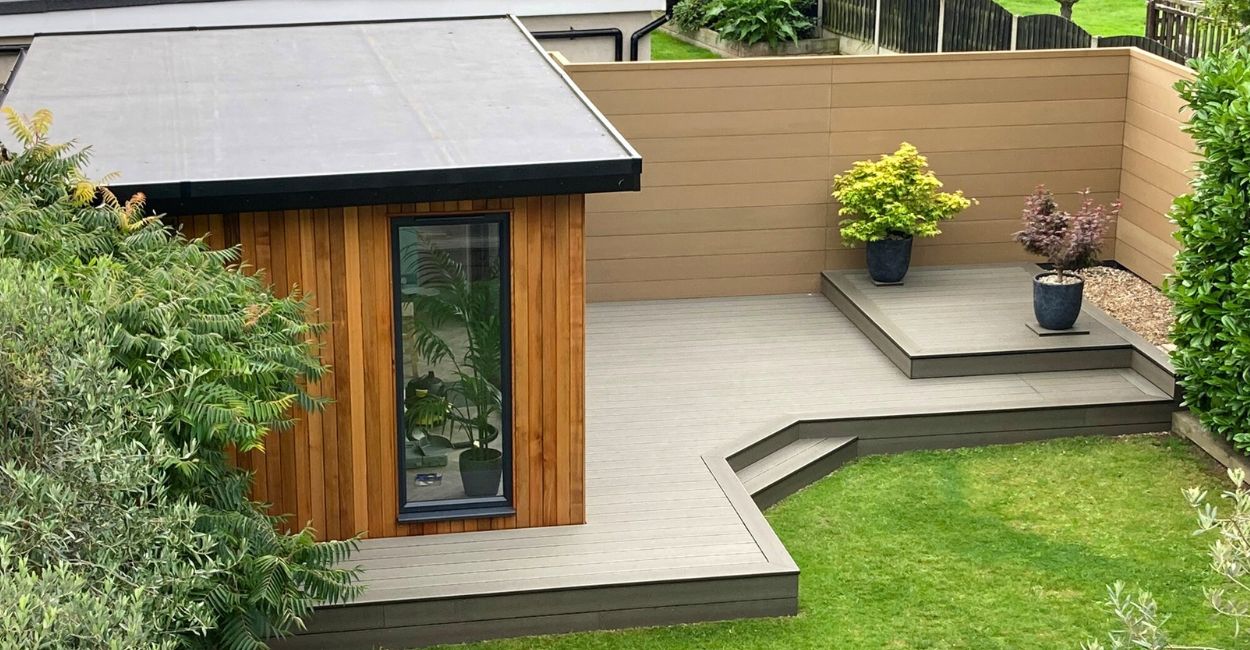 Combination of Composite Decking in Olive Green and Composite Fencing in Teak