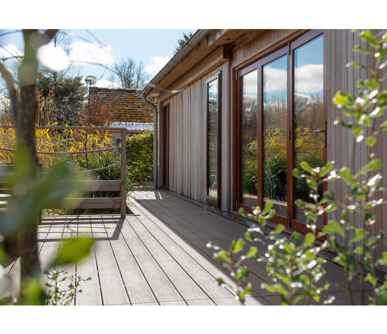 Luxury holiday retreats by Palstone Lodges use Cladco Woodgrain Effect and Original Composite Decking Boards