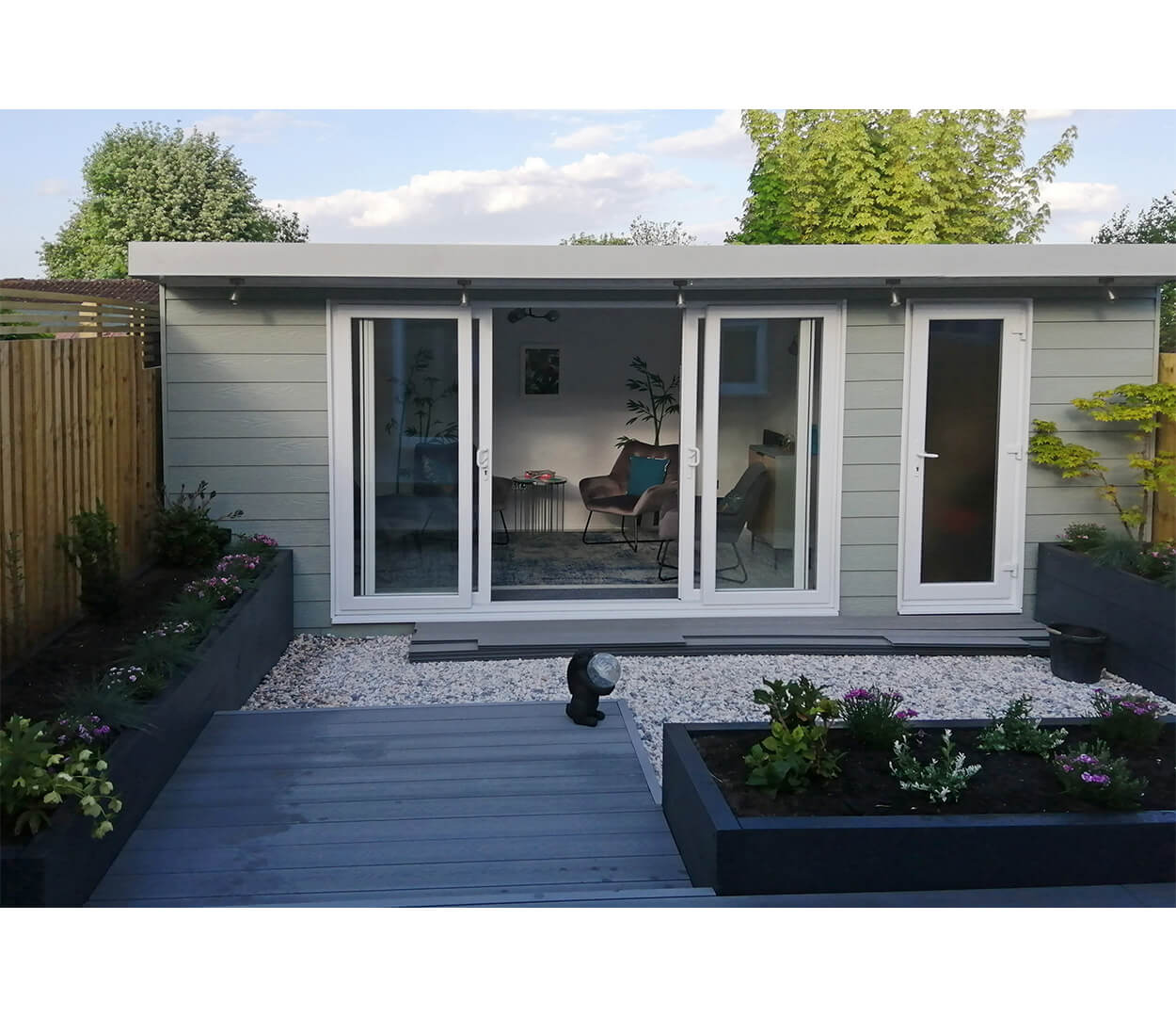 Sage Green Fibre Cement Wall Cladding Boards protect this cosy garden room