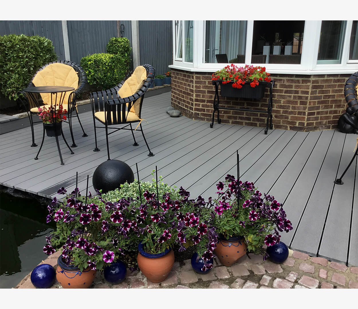 Cladco Composite Decking Boards in Stone Grey with Floral & Stone Boarder