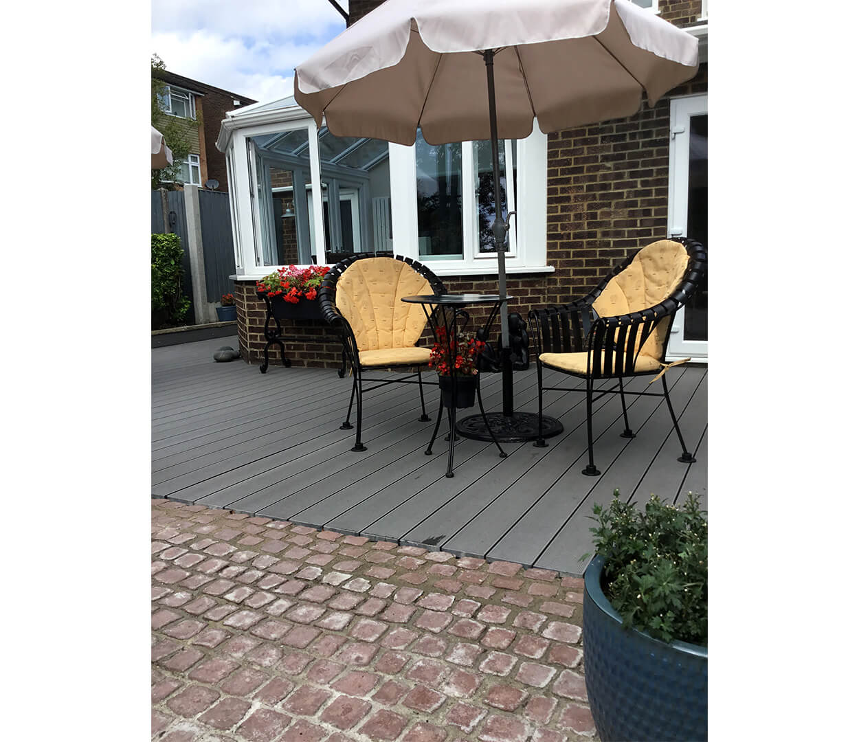 Cladco Composite Decking Boards in Stone Grey with Floral & Stone Boarder