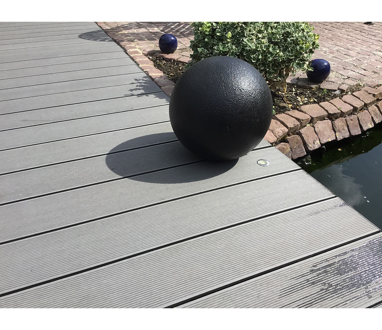 Cladco Composite Decking Boards in Stone Grey with Floral & Stone Boarder
