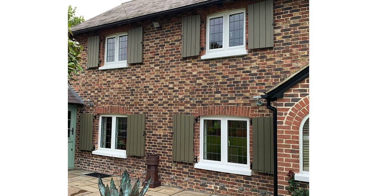 Olive Green Composite Wall Cladding Boards used as bespoke window shutters