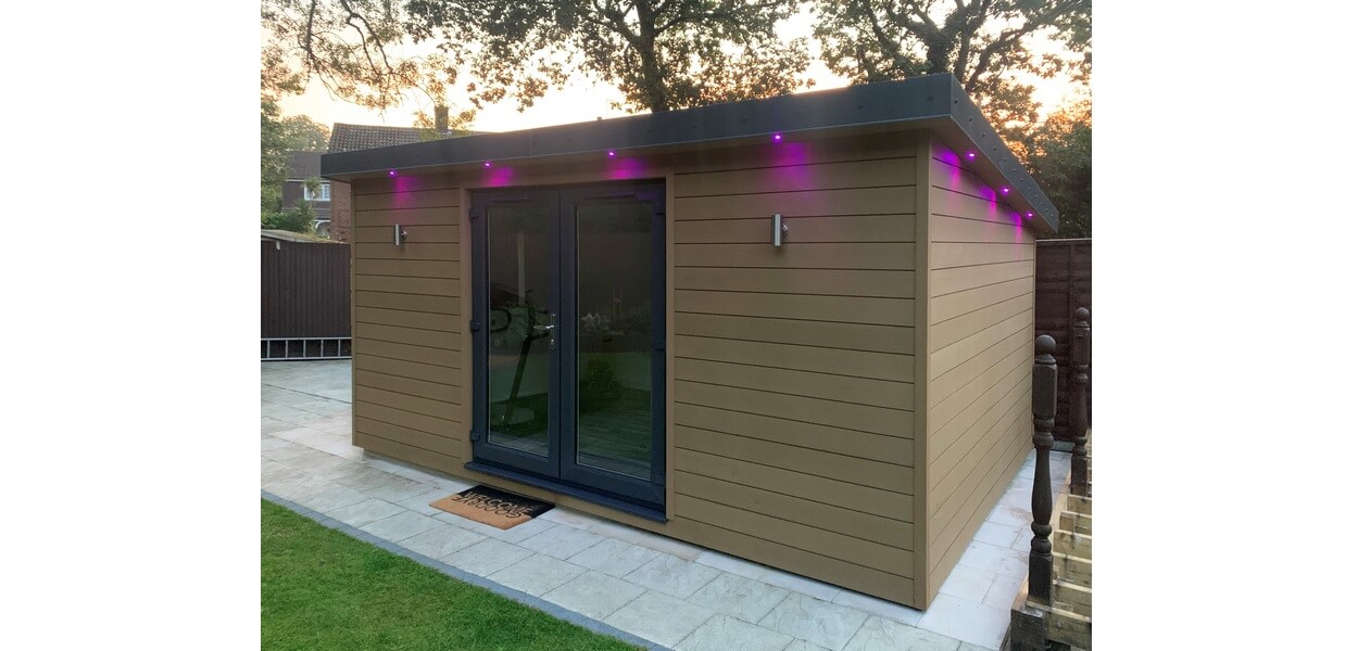 Teak Composite Wall Cladding Boards form the exterior of this garden room