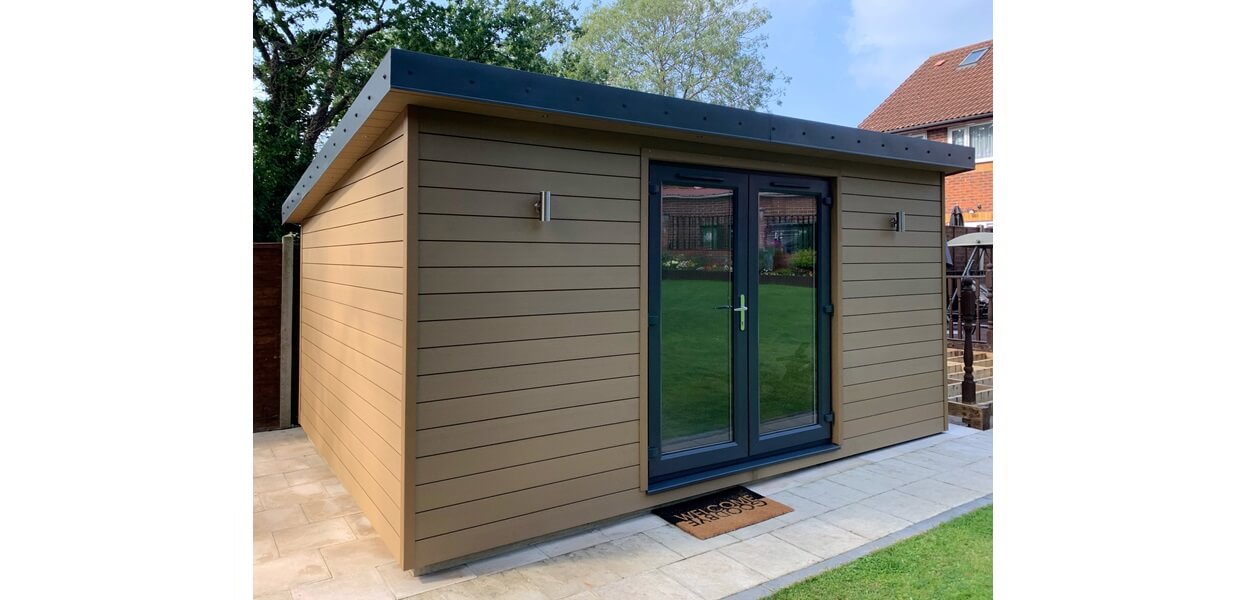 Teak Composite Wall Cladding Boards form the exterior of this garden room