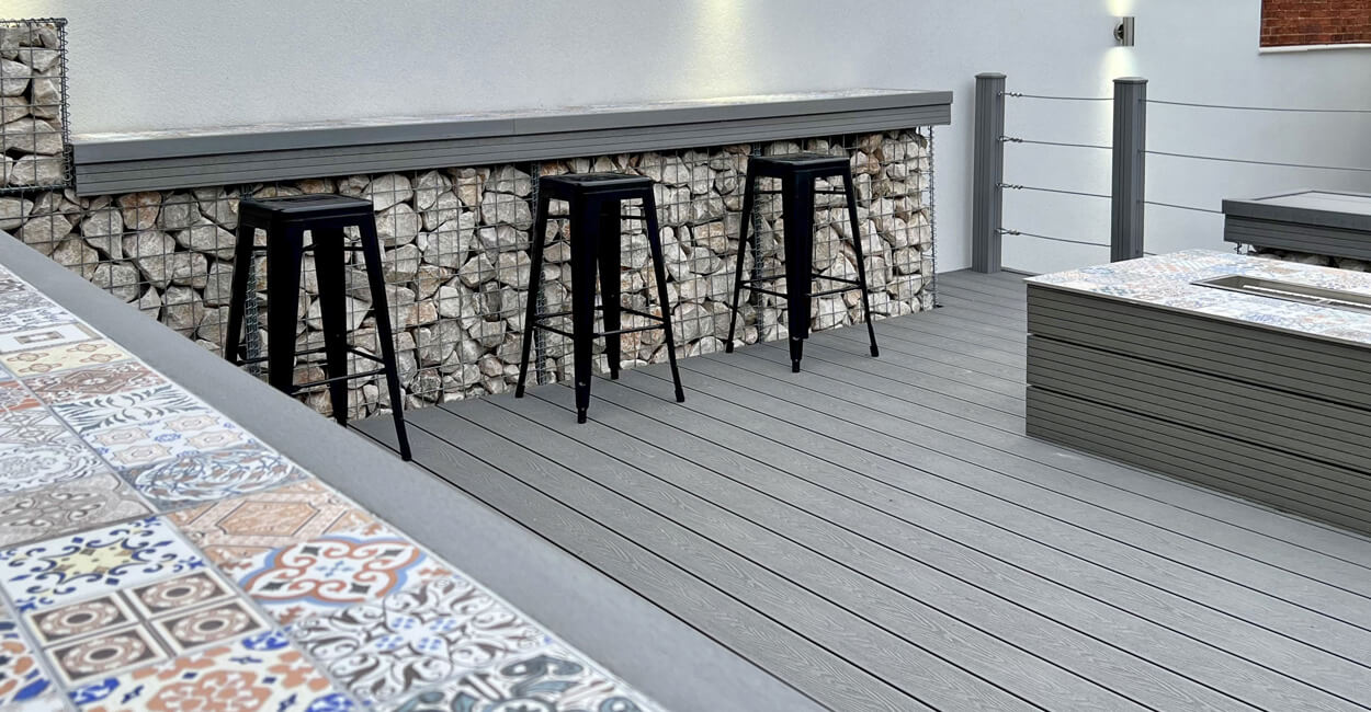 Stone Grey Woodgrain Effect Decking and Fencing Posts create a raised deck