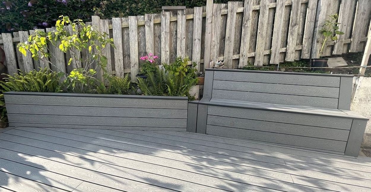 Cladco Woodgrain Composite Decking in Stone Grey for an outdoor seating area