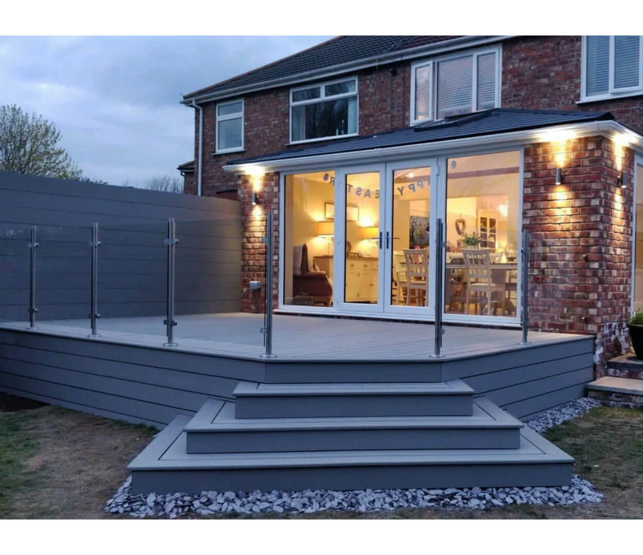 Cladco Light Grey Decking Boards with steps and glass balustrade.