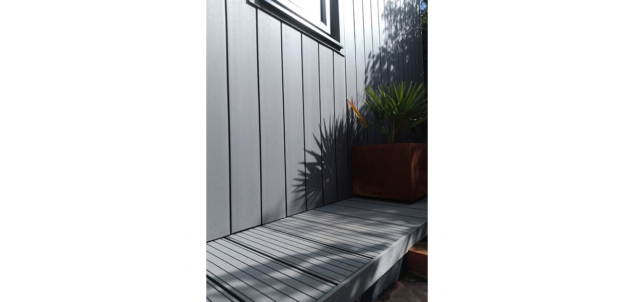Stone Grey Composite Wall Cladding creates a warm and dry garden retreat.