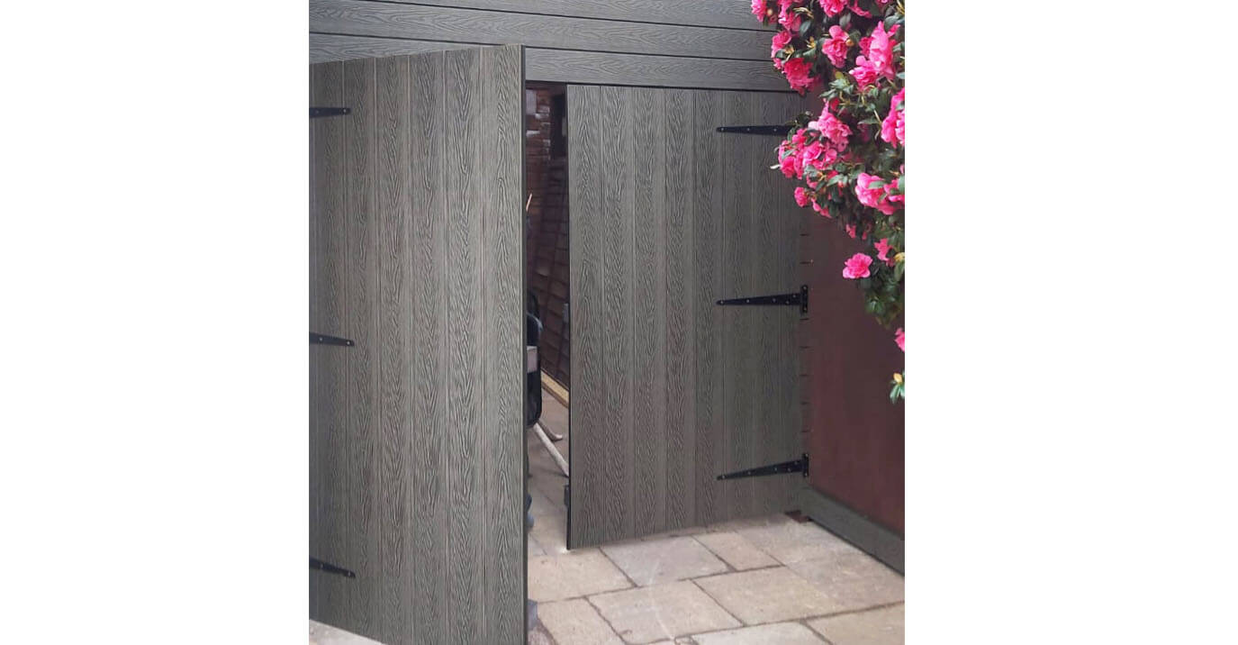 A homeowner has used Cladco Composite Woodgrain Decking for a garage gate 
