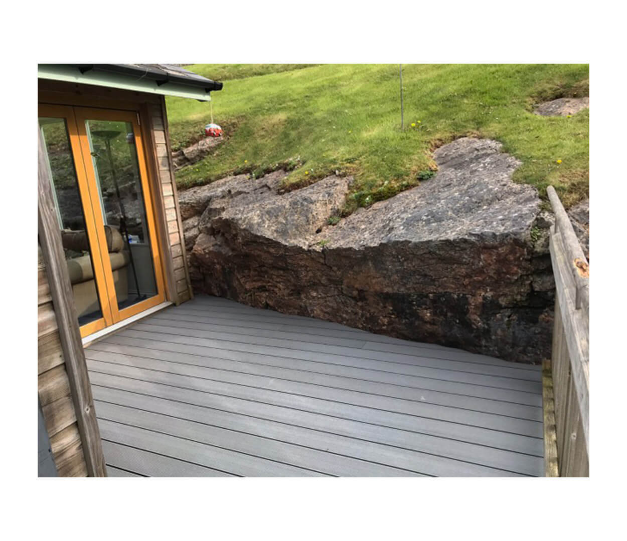 Stone Grey Decking against natural stone