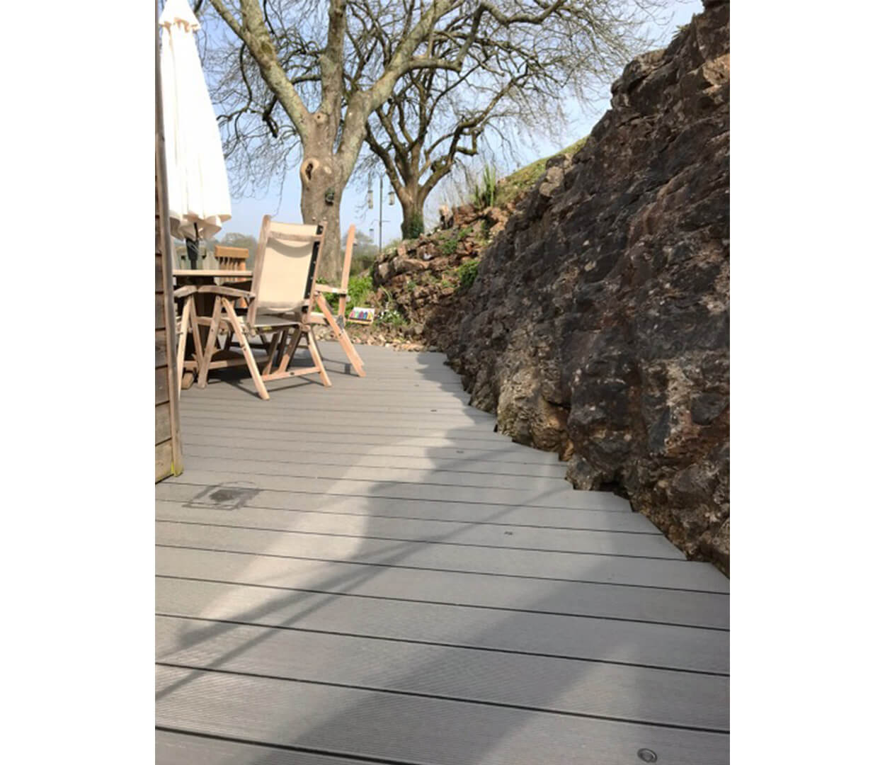 Stone Grey Decking against natural stone