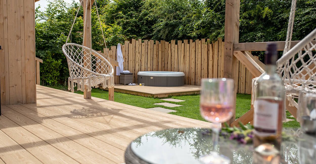 Elevate your outside living space with Cladco Premium PVC Decking Boards in Cedar Wood