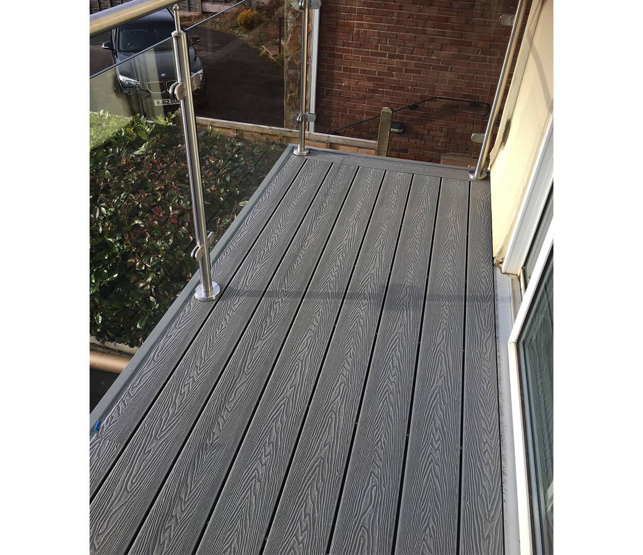 Cladco Woodgrain Decking Boards in Stone Grey complete this balcony 