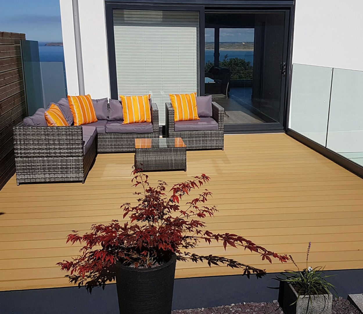 Three Story Contemporary House with Two Decked Areas in Teak and Charcoal.