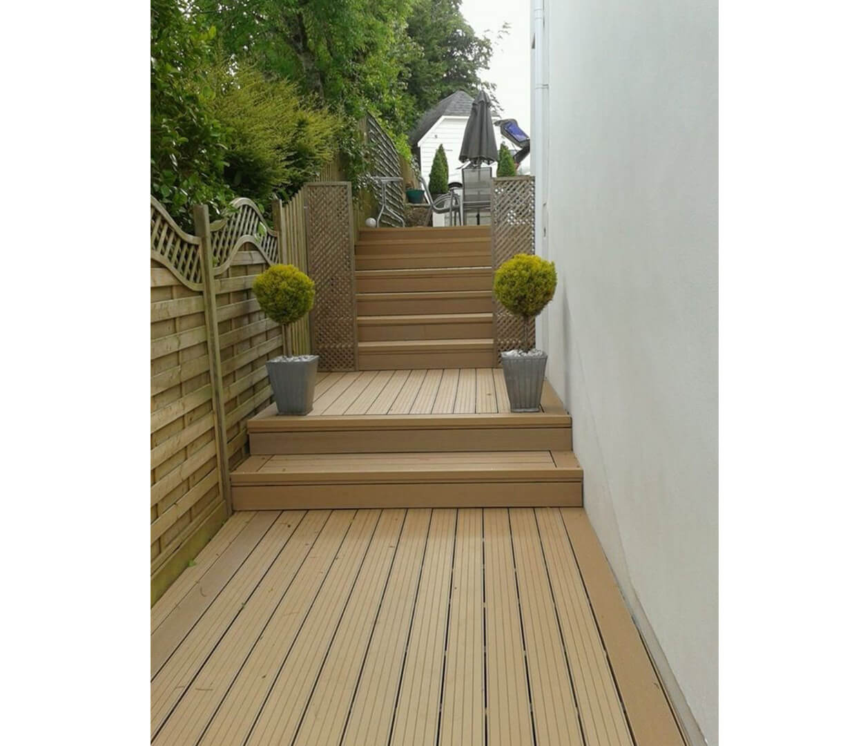 Garden renovation created using decking boards in Teak.