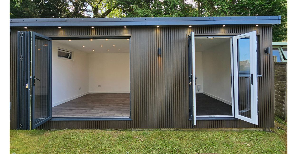 Cladco Composite Slatted Wall Panels in Walnut encase this versatile garden room.