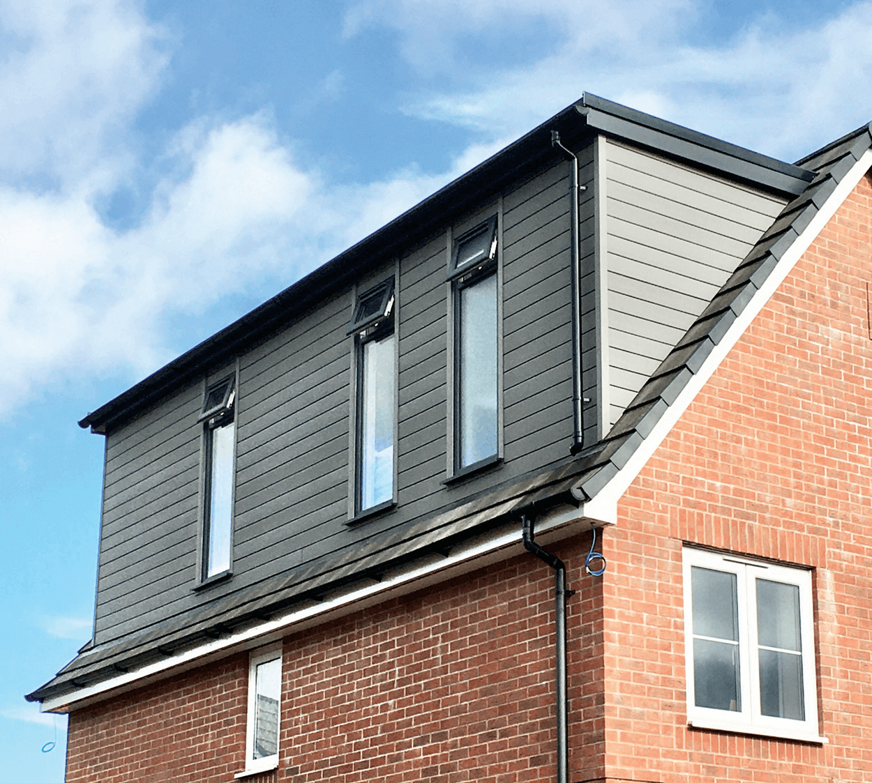 House clad in Stone Grey Cladding Boards