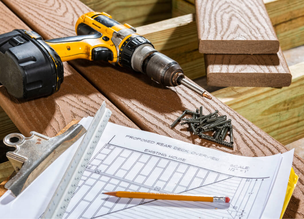 Power Drill on decking with screws and design drawing