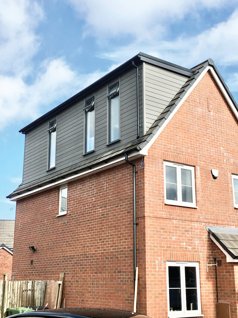 House clad in Stone Grey Cladding Boards
