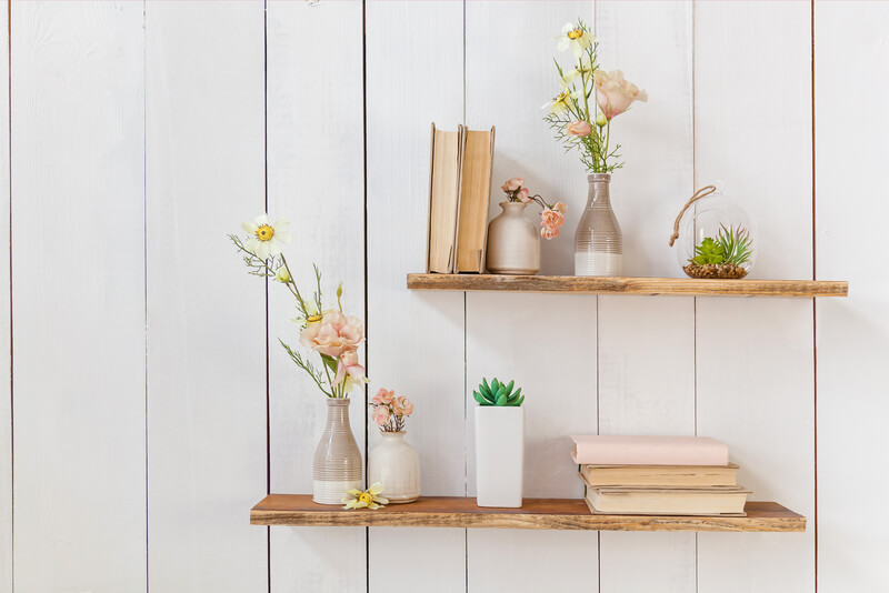Shelving with flowers and books