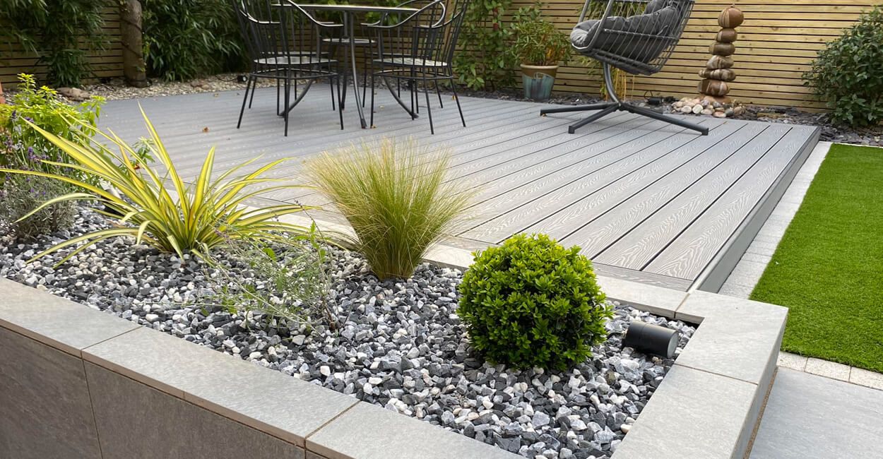 Raised beds adjacent to a Composite Decking area