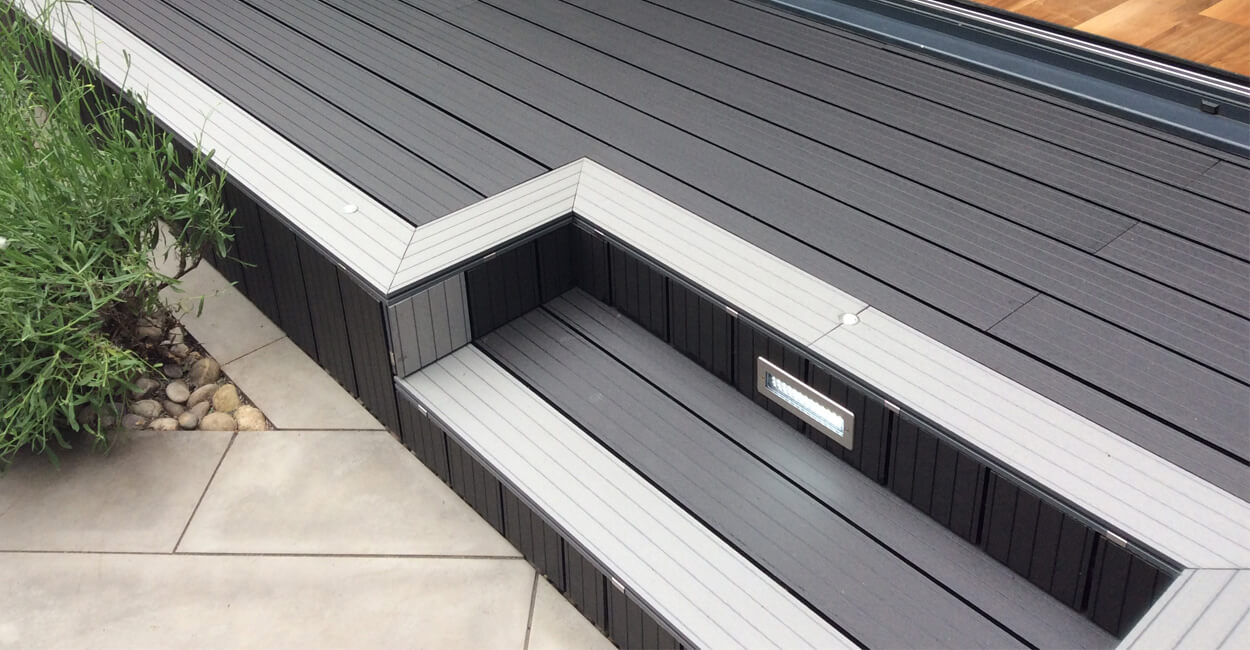 Charcoal decking with light grey edging and steps