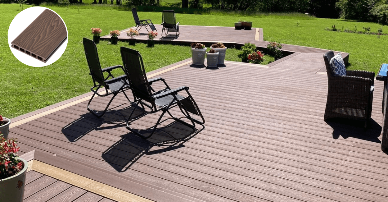 large garden with brown decking sat ontop of a lawn