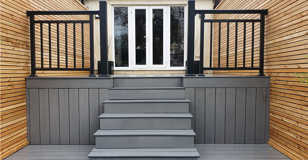 Grey Composite Decking area with a stairway and Balustrades