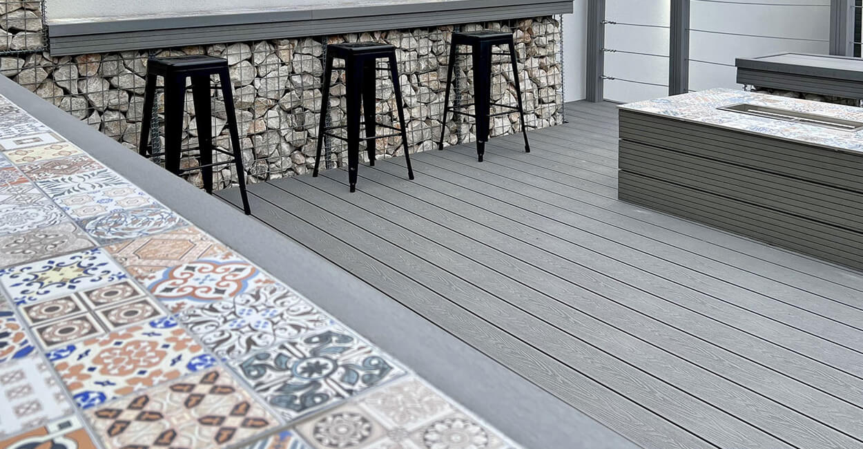 Outdoor dining space improved with Cladco Composite Decking.