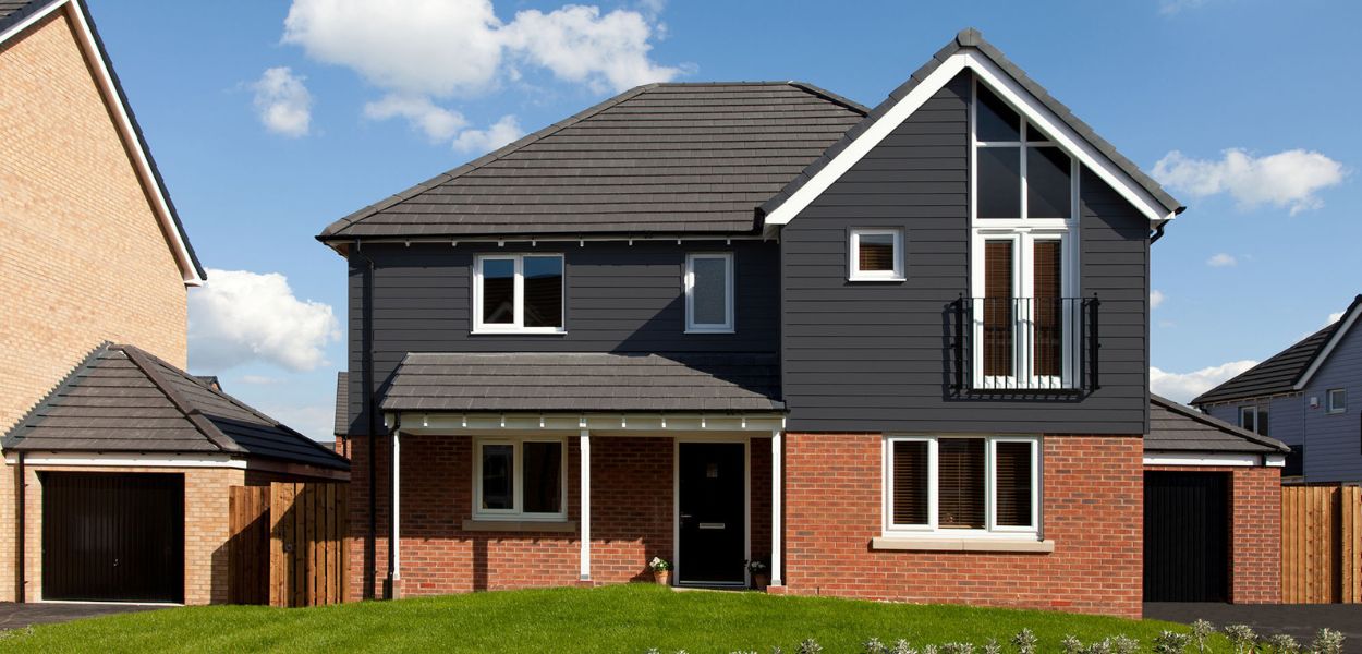 Light Grey coloured Fibre Cement Boards used on a small annex building