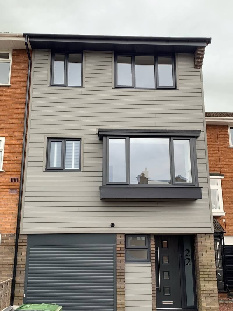 House clad in Stone Grey Cladding Boards