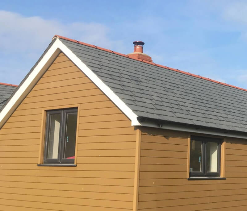 House clad in Teak Cladding Boards